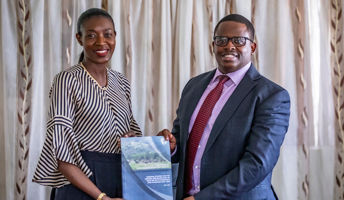 Permanent Secretary, Ministry of Agriculture, and Animal Resources  Olivier Kamana and Coumba Sow, the FAO country Representative during the handover on May 21. Emmanuel Dushimimana