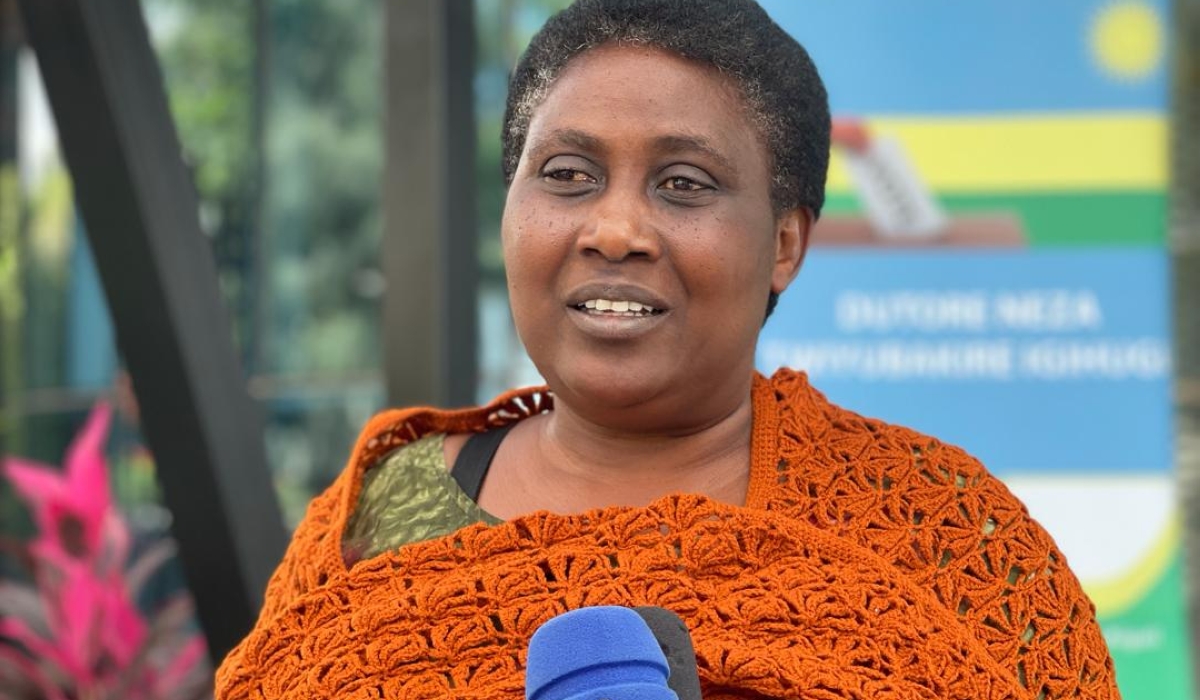 Elisabeth Niyirora, 57, a secondary school teacher at Hanika high school in Nyanza District, speaks to journalists after submitting her candidature on Thursday, May 23. PHOTOS BY EMMANUEL NTIRENGANYA