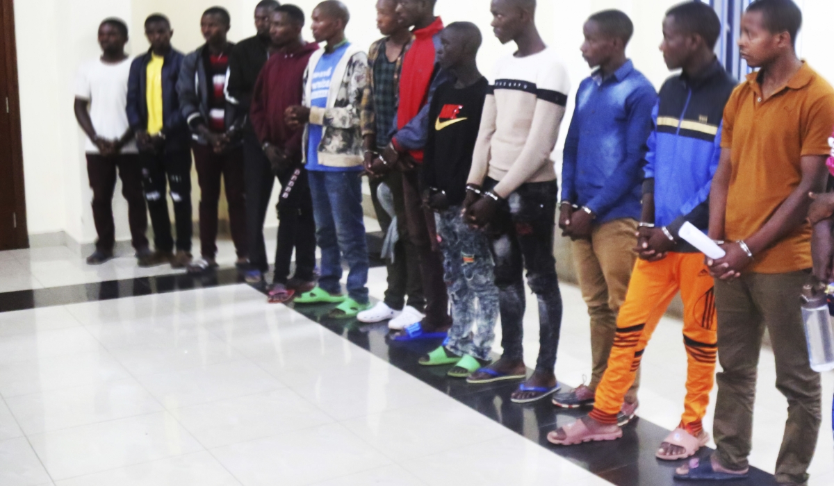 A group of suspects who ran a fraudulent scheme to steal money from people through mobile money. They were paraded at RIB headquarters. File
