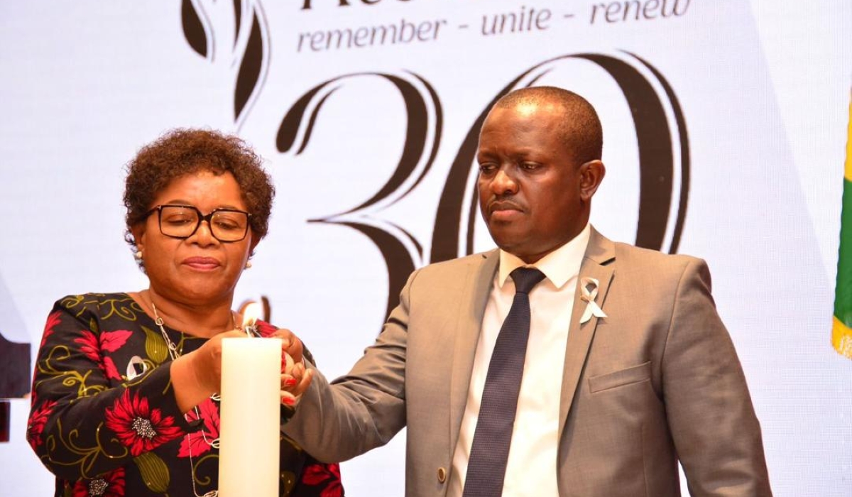 Malawi&#039;s Minister of Foreign Affairs Nancy Tembo and Douglas Gakumba, Chargé d&#039;Affaires of Rwanda&#039;s embassy in Malawi light a flame of hope in honour of victims of the Genocide