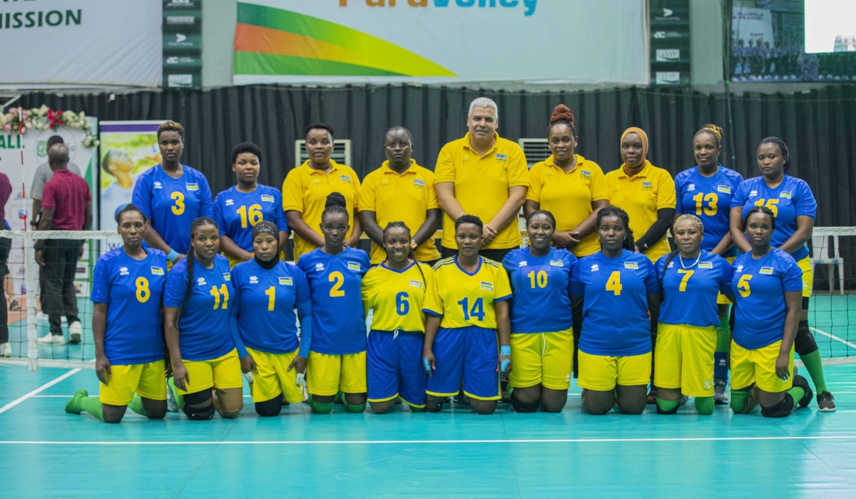 Rwanda women sitting volleyball team head coach Mosaad Rashad Elaiuty and his players pose for a group photo. Courtesy