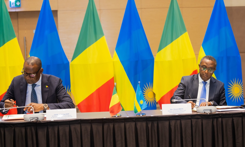Biruta and his Malian counterpart Abdoulaye Diop sign the agreements in a joint meeting in Kigali on Monday, May 27.