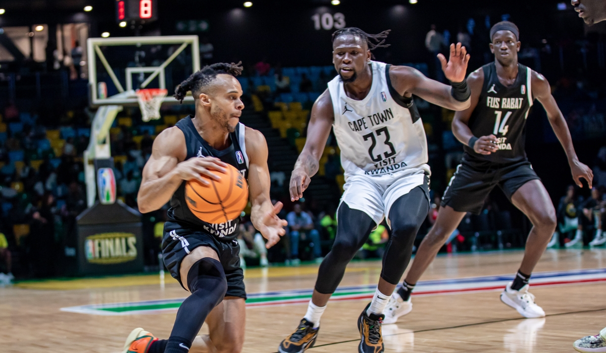 Tigers&#039; Samkelo Cele (C) tries to guard Rabat&#039;s John Jordan (L) during pair&#039;s quarterfinal crunch game on Sunday, May 26. Tigers prevailed with a 91-88 win that sent them through to the semifinals. All photos by Dan Gatsinzi