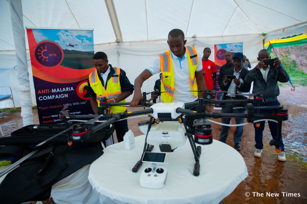 Technicians fixing a drone that was used in spraying during a country wide campaign on fighting agaisnt Malaria