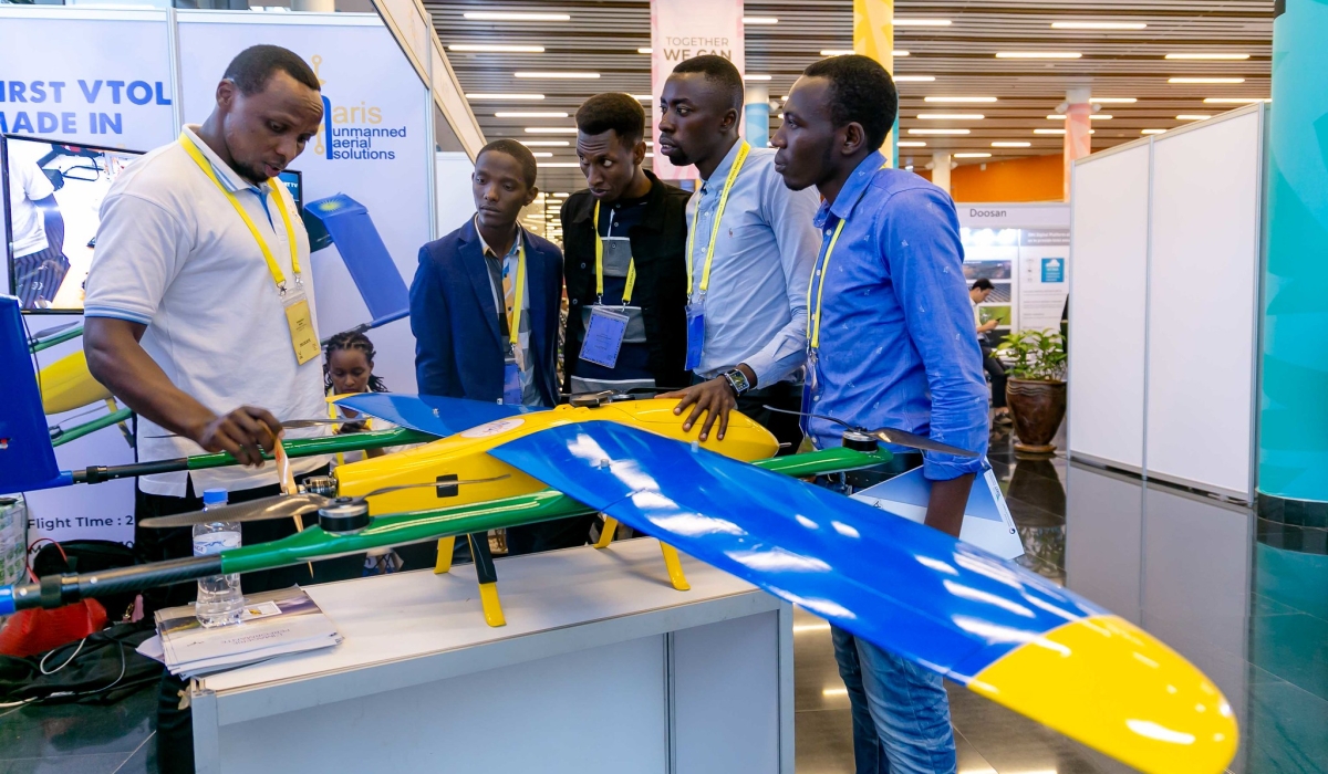 Visitors interact with an exhibitor who was showcasing a Made in Rwanda drone. Rwanda has allocated Rwf2.3 billion in the 2024-2025 fiscal year as initial funding for setting up a Drone Operation Centre. Sam Ngenda