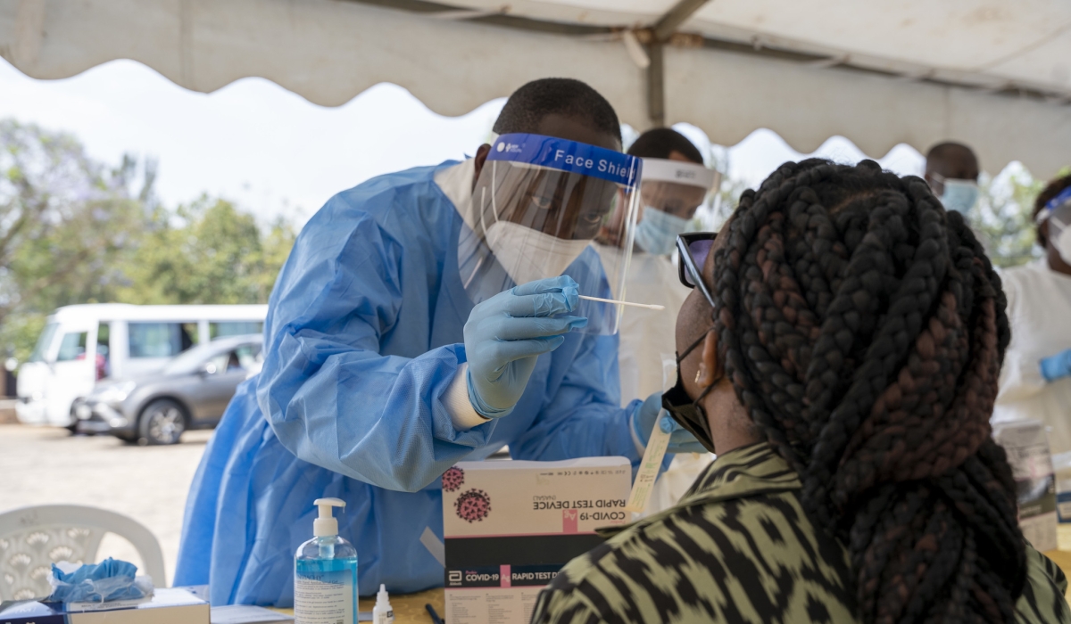 A health worker conducts  the covid 19 mass testing in Kigali on July 17, 2021. Craish Bahizi