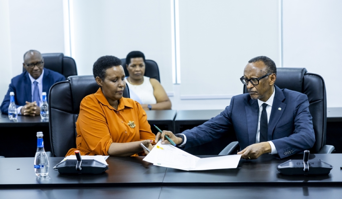 President Paul Kagame (R) presents his candidature to the Chairperson of the National Electoral Commission, Oda Gasinzigwa, on May 17, 2024, as he seeks re-election as the Head of State (courtesy)
