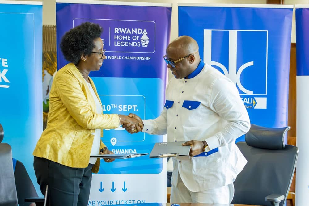 Bank of Kigali CEO Diane Karusisi and Fred Siewe, the founder of Veterans Club World Championship  sign a three-year partnership deal on Friday, May 31. Courtesy