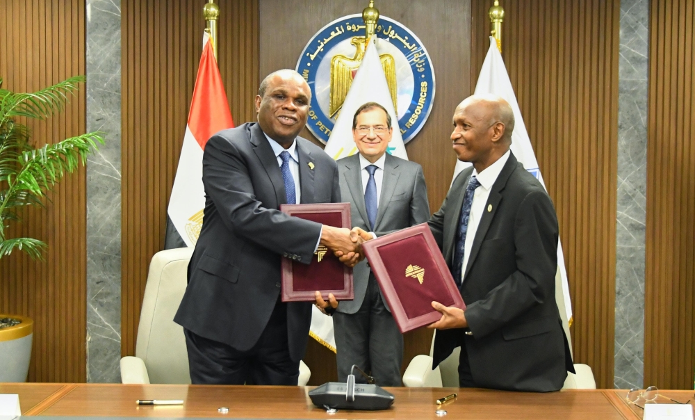 Tarek El Molla, Egyptian Minister of Petroleum and Mineral Resources looks on as Benedict Oramah, President and Chairman of Board of Directors, Afreximbank (left) exchanges Establishment Agreement documents for the Africa Energy Bank with Omar Farouk Ibrahim, Secretary General of APPO (left).