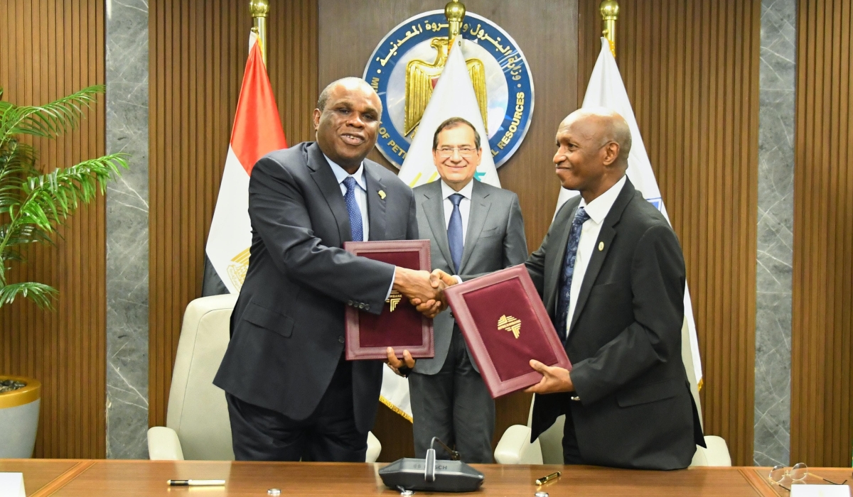 Tarek El Molla, Egyptian Minister of Petroleum and Mineral Resources looks on as Benedict Oramah, President and Chairman of Board of Directors, Afreximbank (left) exchanges Establishment Agreement documents for the Africa Energy Bank with Omar Farouk Ibrahim, Secretary General of APPO (left).