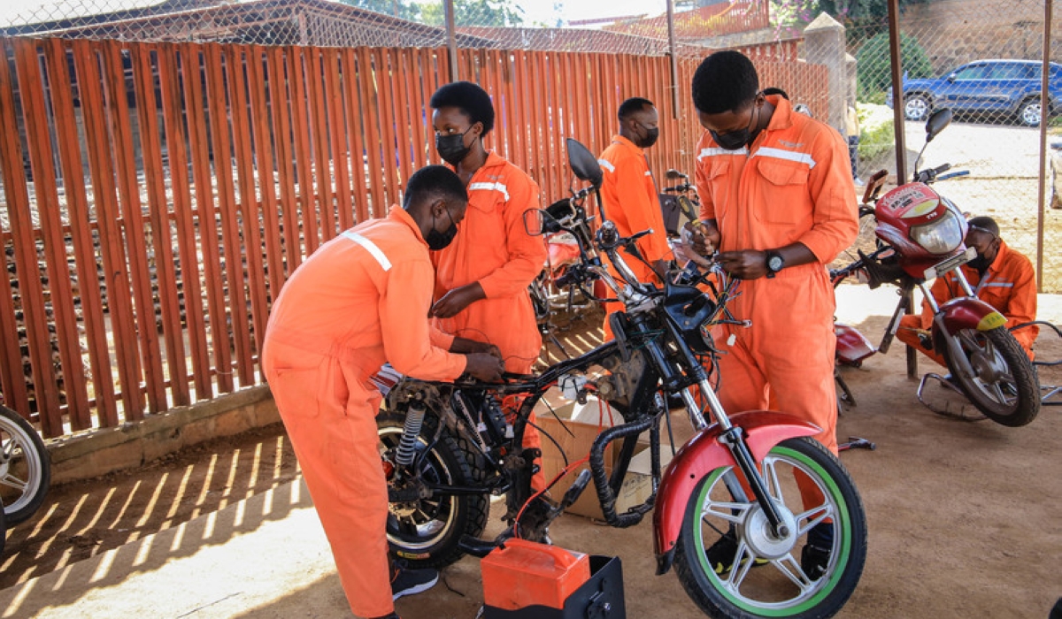 Students of IPRC Kigali retrofitting of fossil fuel motorcycles to electric motorcycles at Rwanda Electric Mobility Ltd in Kicukiro district on June 10, 2021. File