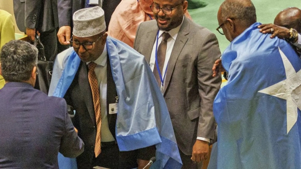 Somali officials celebrated in the General Assembly after the vote. EPA
