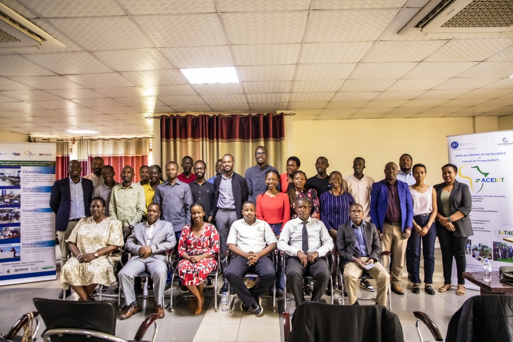 Participants pose for a group photo at a workshop on a project titled “IoT and AI Applied Research Result Commercialization Through Incubation Hub”. Emmanuel Dushimimana