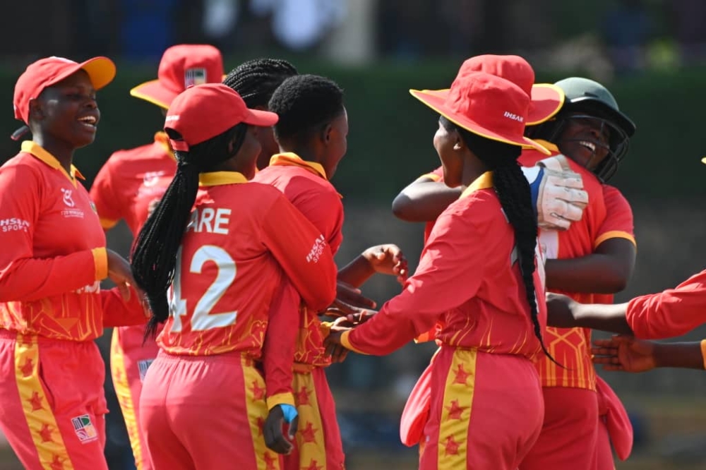 Zimbabwe players celebrate after taking the wicket of Uganda captain Janet Mbabazi