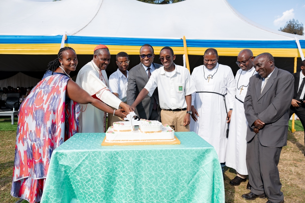 Cardinal Antoine Kambanda and Minister of Education Gaspard Twagirayezu join students to cut a cake during Lycee de Kigali&#039;s celebration of golden jubilee  on Saturday, June 8. Photos by Christianne Murengerantwari