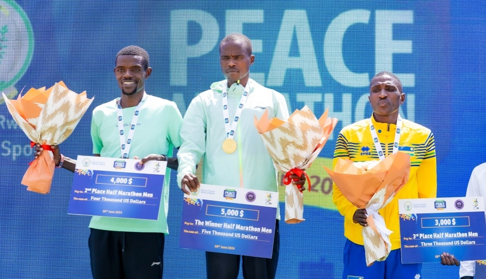 Rwanda’s Emmanuel Mutabazi (R) struck bronze medal in the men’s half marathon. The Police Athletics club runner believes Rwandans have what it takes to win big races of Kigali International Peace Marathon caliber-courtesy