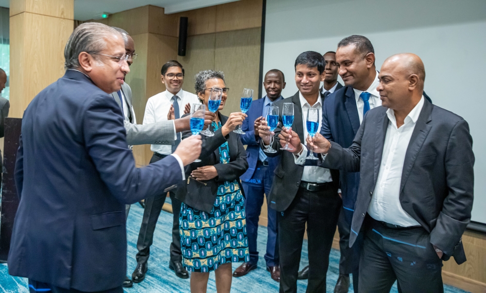 Officials toast during the celebration. LOLC is a multinational diversified conglomerate operating in 26 countries across Africa, Asia, and Australia. Photos by Wily Mucyo