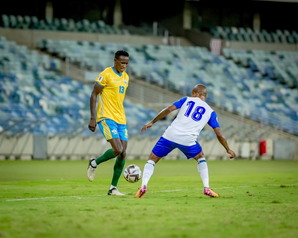 Fitina Ombolenga tries to dribble past Lesotho player during the game