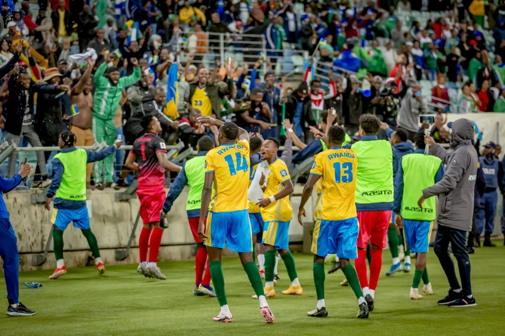 Supporters cheer on national team players while celebrating a 1-0 win against Lesotho on Tuesday, June 11