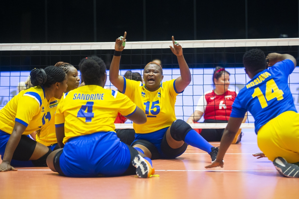Liliane Mukobwankawe, the national sitting volleyball team captain celebrates with her teammates.