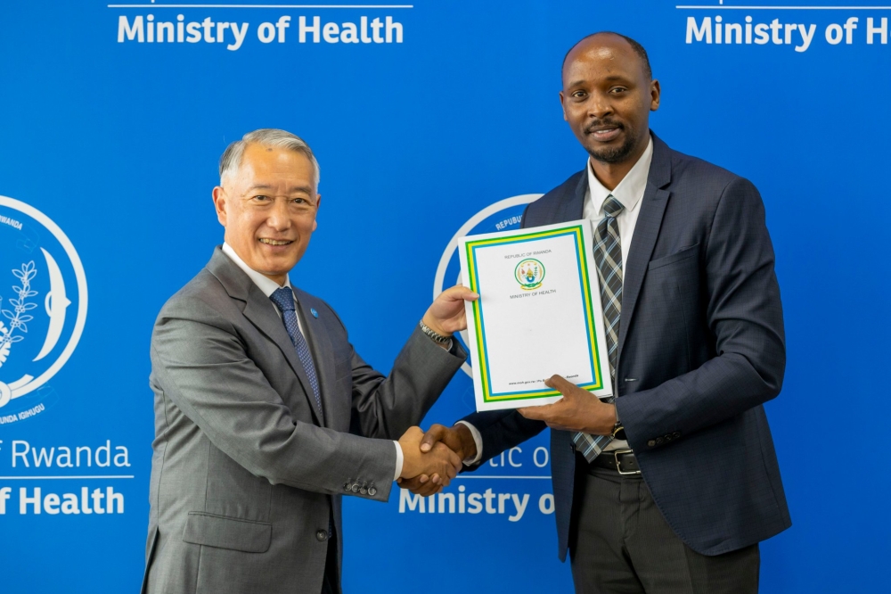 Rwandan Minister of Health Dr Sabin Nsanzimana and Dr Jerome H. Kim, the Director General of the International Vaccine Institute, after signing a Memorandum of Understanding (MoU) setting out the process for the establishment of the IVI African Regional Office in Rwanda, on Tuesday, June 11.
