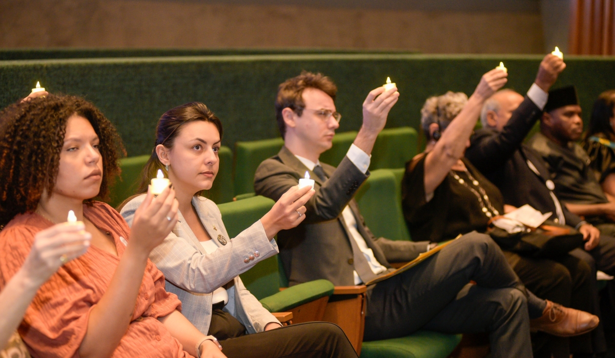 Mourners hold lit candles in honour of victims of the Genocide against the Tutsi, in Brazil. The commemorative event, held in the Legislative Assembly of the Federal District, was attended by Genocide survivors, Brazilian officials, and members of the diplomatic corps, among others. Courtesy