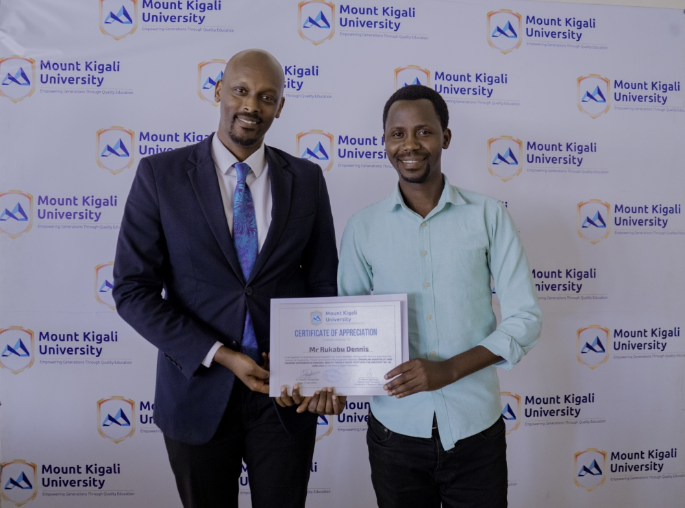 Hôtel des Mille Collines’ Operations Manager Dennis Rukabu (left) receives a certificate of appreciation from Denys Ntakirutimana, a lecture at Mount Kigali University.