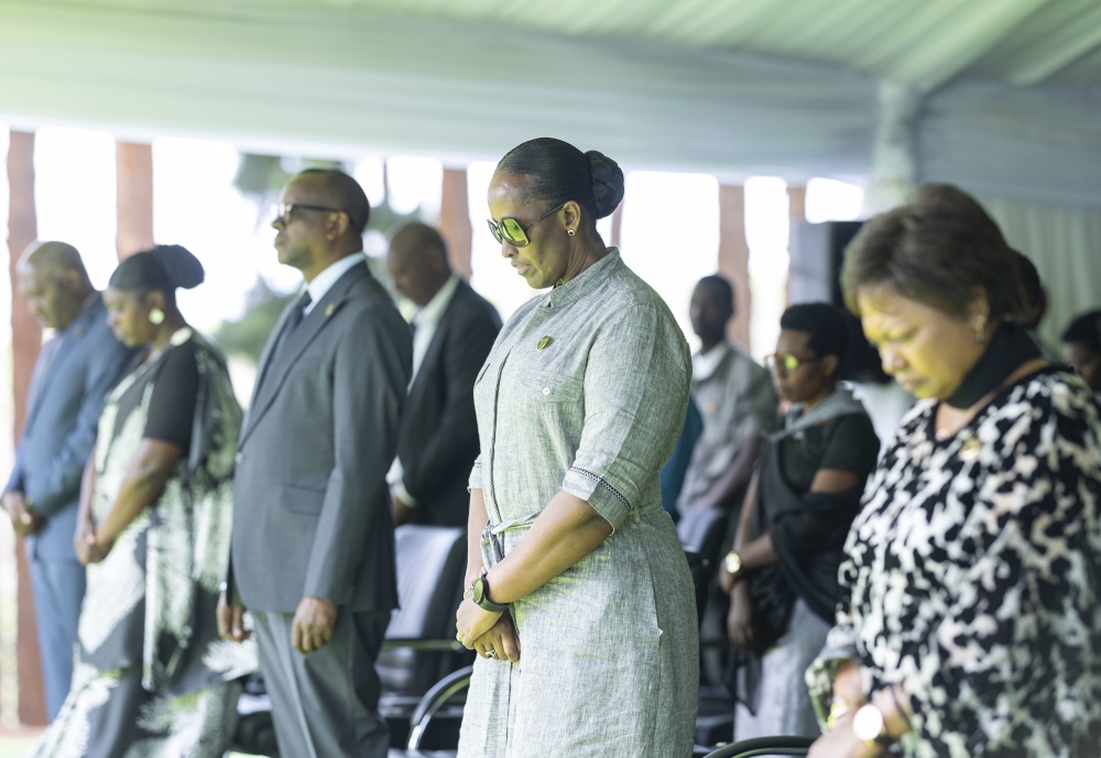 First Lady Jeannette Kagame and mourners observe a moment of silence in honour of victims during the decent burial of 41 Genocide victims at Bisesero Genocide Memorial on Saturday, June 15