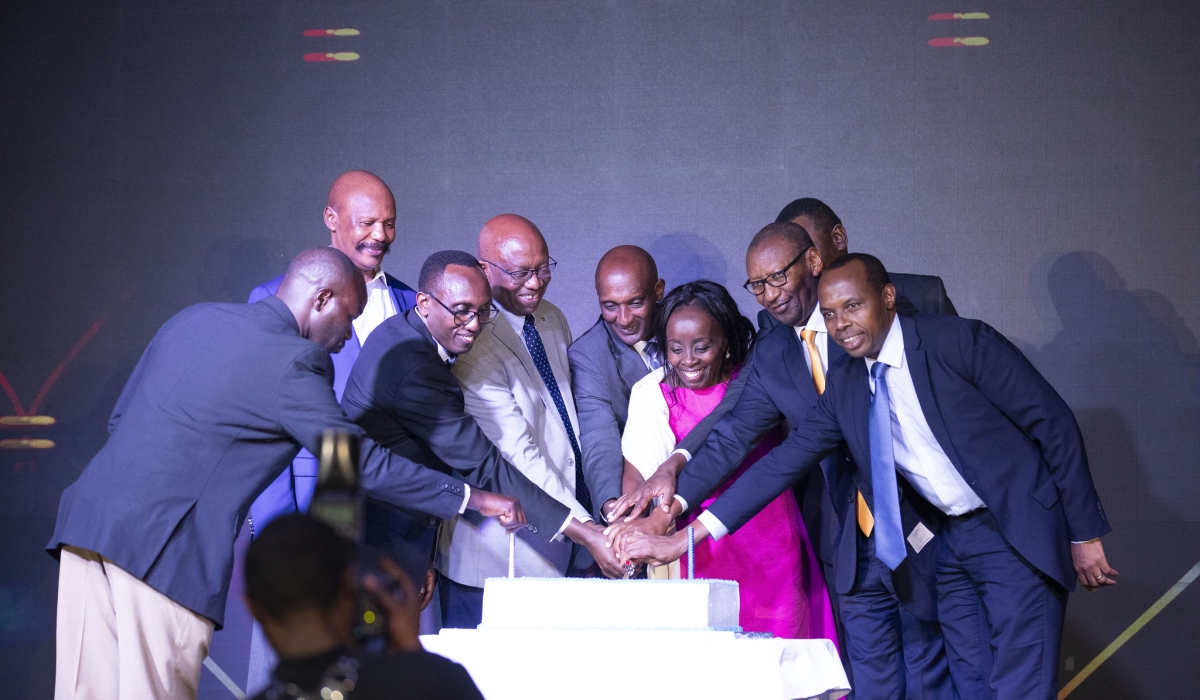 Officials cut a cake as I&M Bank Rwanda celebrated its golden jubilee marking 50 years of financial sector on June 13. Photos by Emmanuel Dushimimana