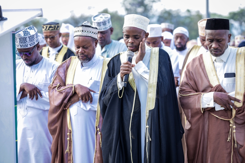 Mufti of Rwanda Musa Sindayigaya leads Muslims  to celebrate Eid al-Adha  at Kigali Pele Stadium in Nyamirambo on Sunday, June 16. All photos by Craish Bahizi