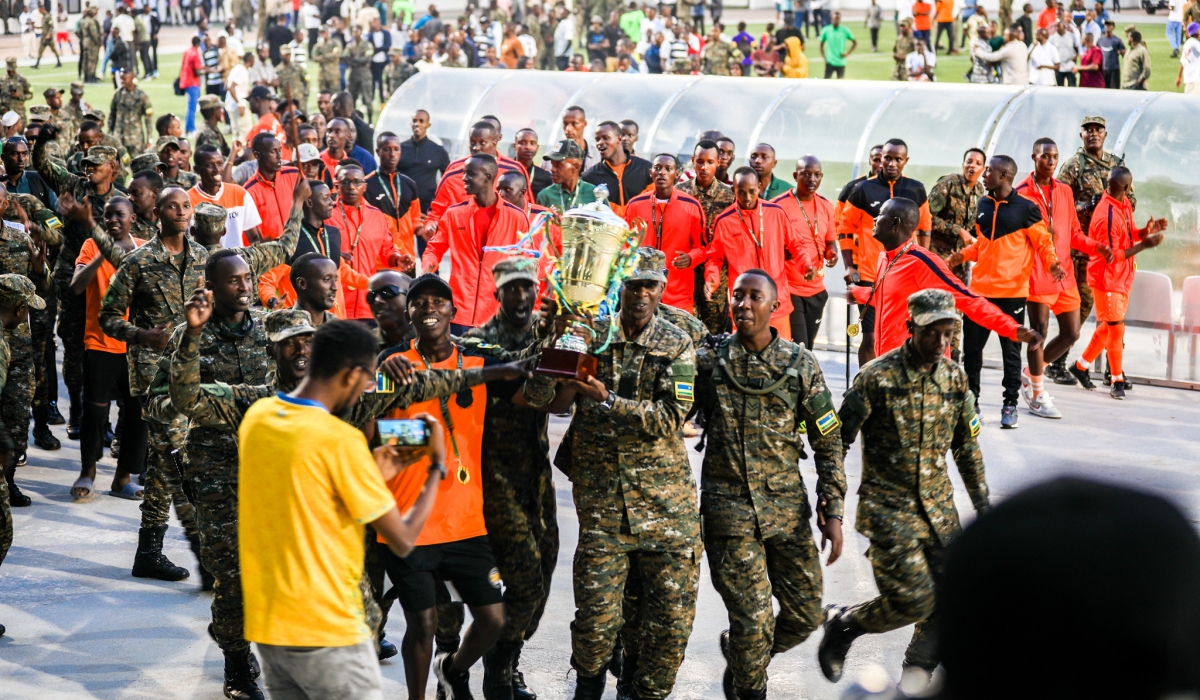 The Republican Guard team players and supporters celebrate the victory for winning their third straight RDF Liberation Cup tournament after defeating BMTC Nasho 3-0 in the 2024 final match at Kigali Pele stadium on Sunday, June 16. Photo by Craish Bahizi