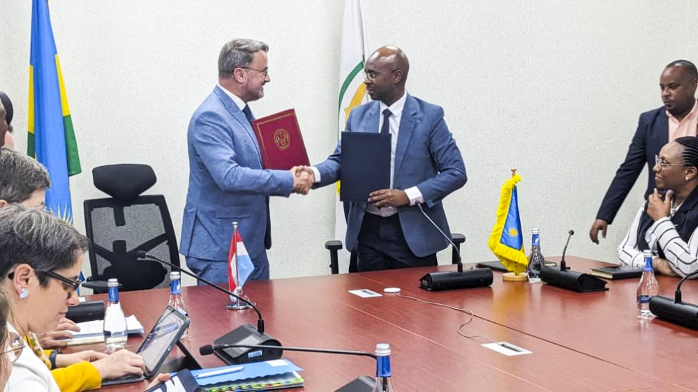 Minister for Finance and Economic Planning, Yusuf Murangwa and  Luxembourg Deputy Prime Minister, Xavier Bettel during the signing of a €12 million grant on Tuesday June 18.  Michel