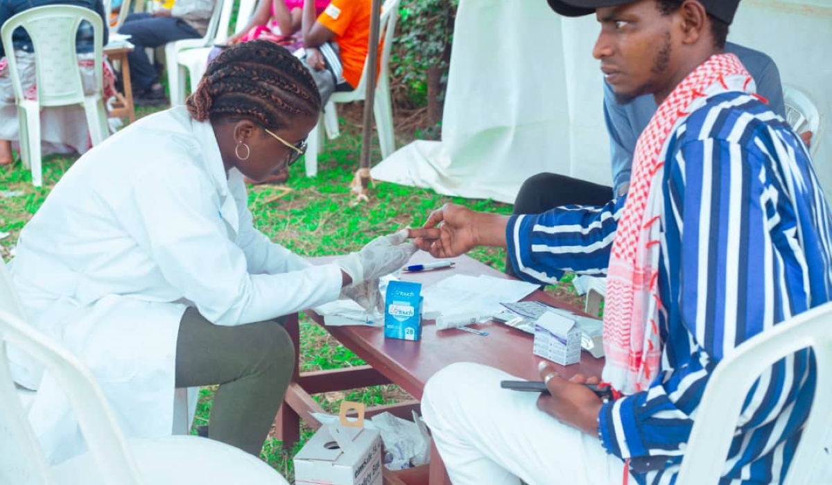 A nursing graduate, among the youth on a mission to educate and raise awareness on HIV, tests a Rwamagana resident