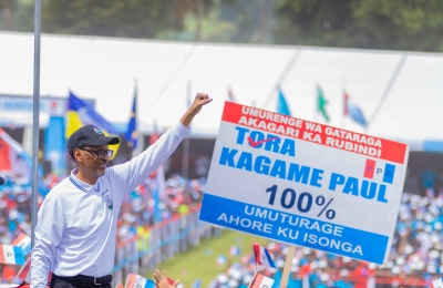 RPF Inkotanyi  flag-bearer, President Paul Kagame greets thousands of residents during the launch of the presidential campaign in Busogo, Musanze District, on Saturday, June 22. 