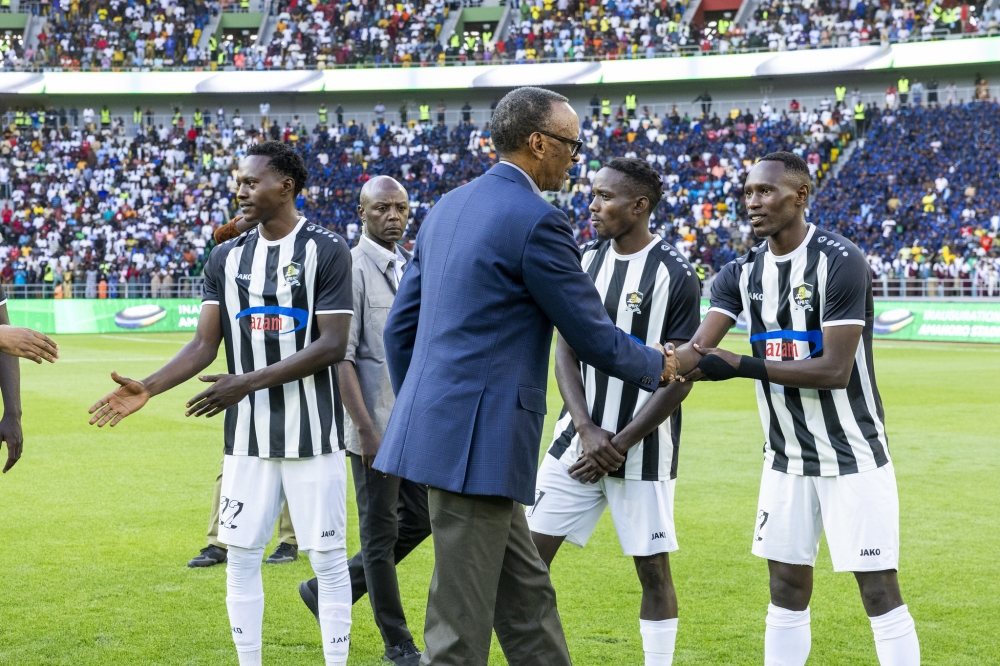 President Kagame greets APR FC players before a friendly match against Police FC at the inauguration of Amahoro stadium on Monday, July 1. Olivier Mugwiza