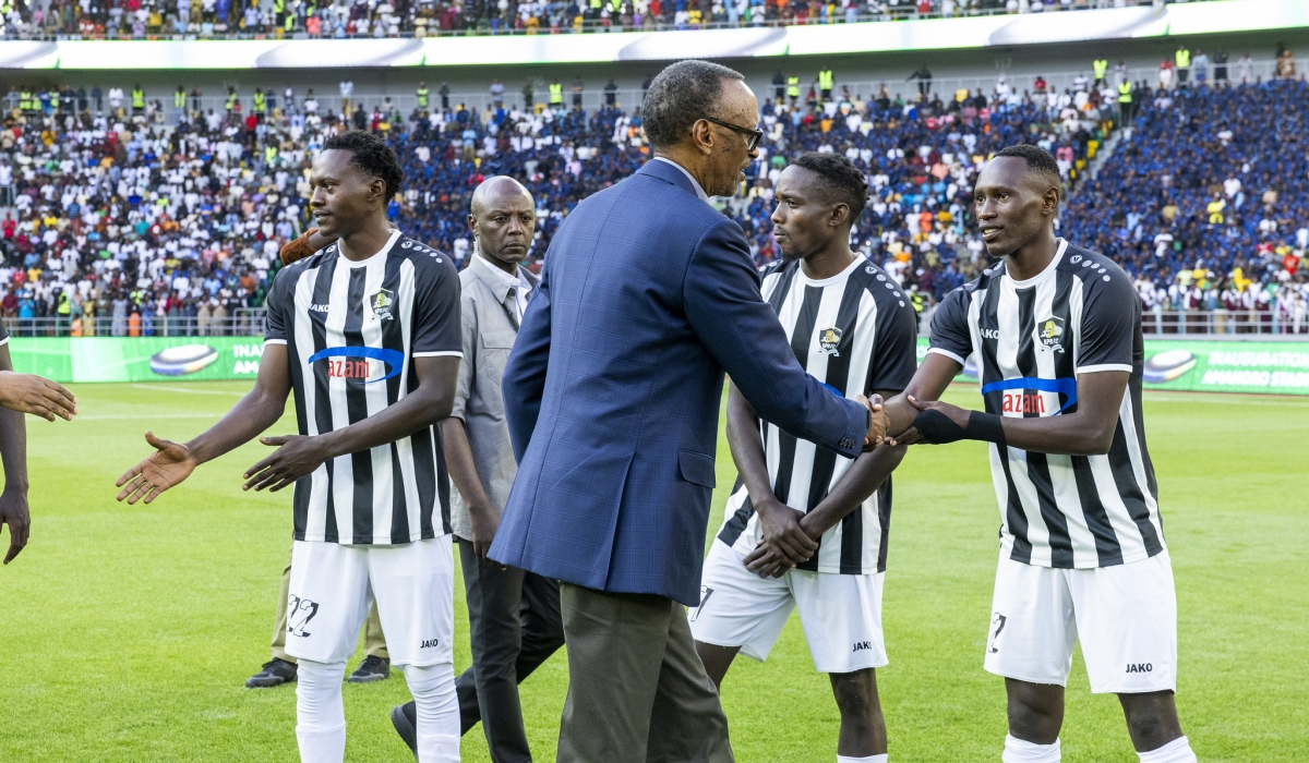President Kagame greets APR FC players before a friendly match against Police FC at the inauguration of Amahoro stadium on Monday, July 1. Olivier Mugwiza