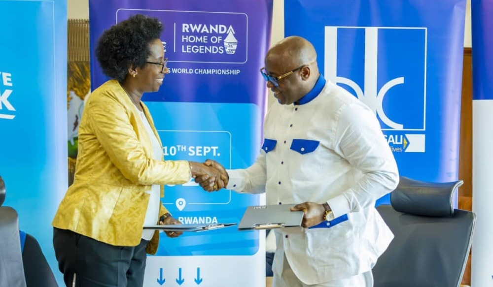 Bank of Kigali CEO Diane Karusisi and Fred Siewe, the founder of Veterans Club World Championship sign A partnership deal on Friday, May 31. Bank of Kigali (BK) has canceled their one-year partnership deal. Courtesy