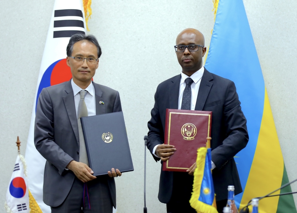 Minister of Finance and Economic Planning Yusuf Murangwa and the Ambassador of the Republic of Korea, Jeong Woo Jin, after signing a US $1 billion framework arrangement on Friday, July 5, in Kigali.