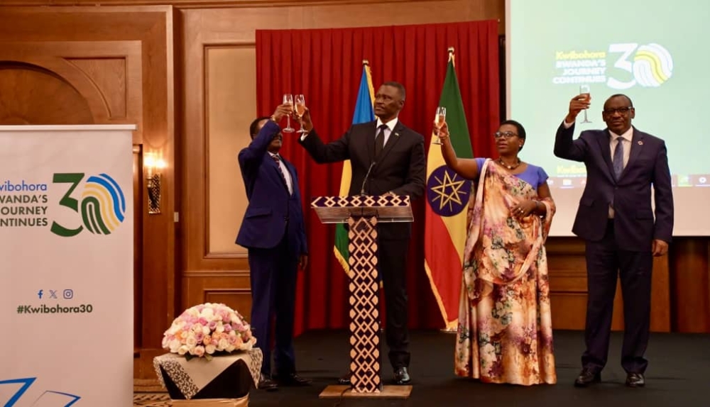 (L-R) Fissaha Shawel, the representative of  the Ethiopian government,  Ambassador of Rwanda Charles Karamba ,Monique Nsanzabaganwa, the Deputy Chairperson for the African Union Commission, Claver Gatete, Executive Secretary of the UN Economic Commission for Africa (UNECA) toast to celebrate the 30th Liberation anniversary. Courtesy