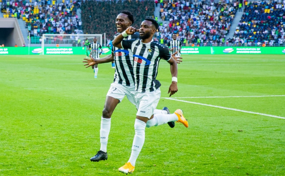 APR FC winger Gilbert Mugisha (R) and teammate celebrate a goal as they beat Police FC 1-0 during the inauguration of Amahoro Stadium. Olivier Mugwiza