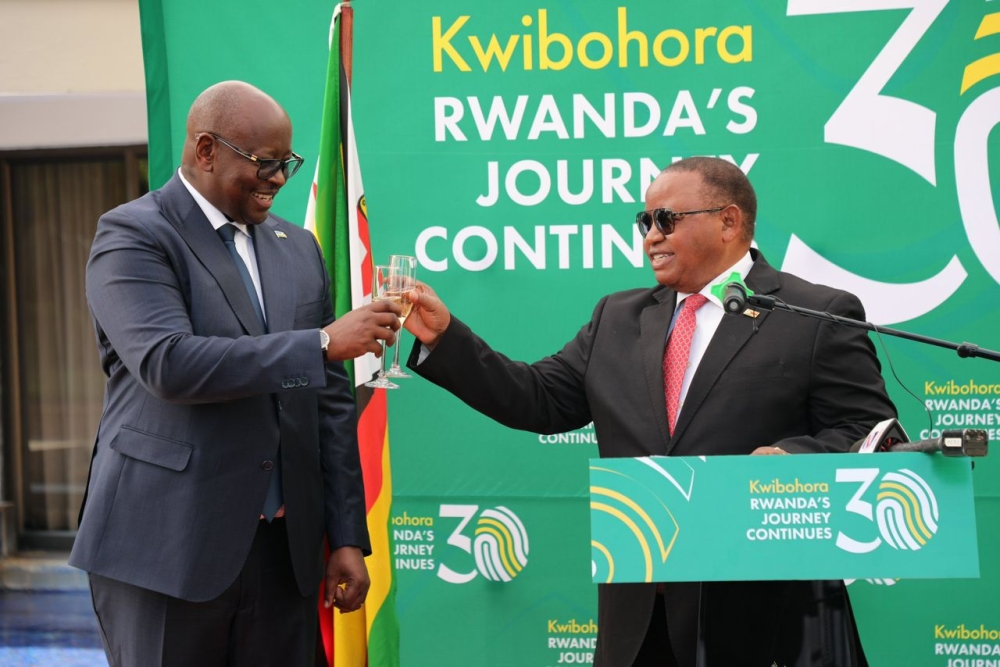 Rwanda&#039;s Envoy James Musoni and Zimbabwe’s Minister of Foreign Affairs and International Trade Frederick Shava  toast during Kwibohora 30 celebrations in  Zimbabwe in Harare on Thursday, July 11. Courtesy