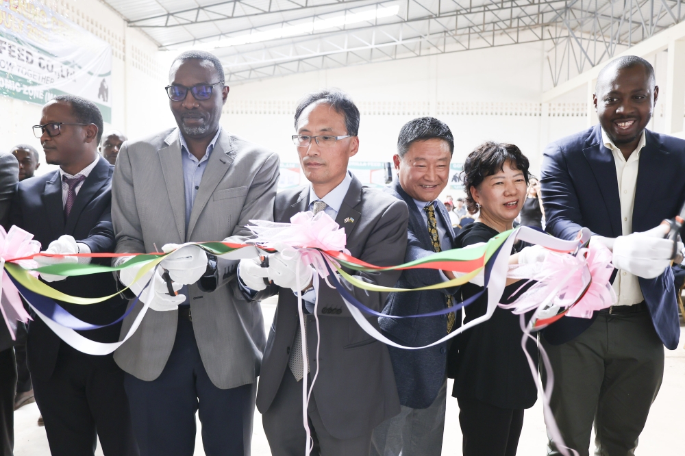Dr Christian Sekomo Birame, Director of NIRDA (2nd L) and Gorilla Feeds officials during the launch of the new factory in Kigali.