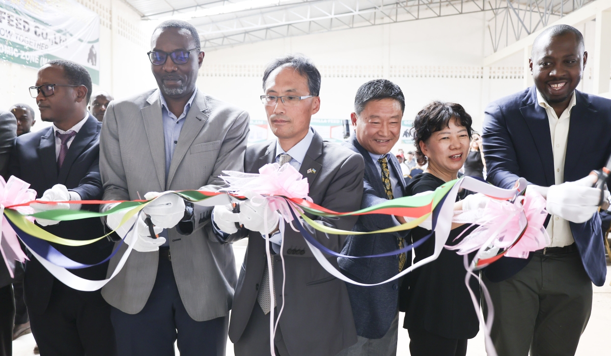 Dr Christian Sekomo Birame, Director of NIRDA (2nd L) and Gorilla Feeds officials during the launch of the new factory in Kigali.