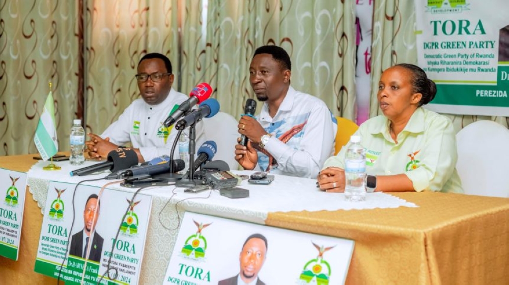 Presidential candidate of the Green Party, Frank Habineza(C), and his party members address the media during a press conference held in Kigali on July 11. Photo Courtesy