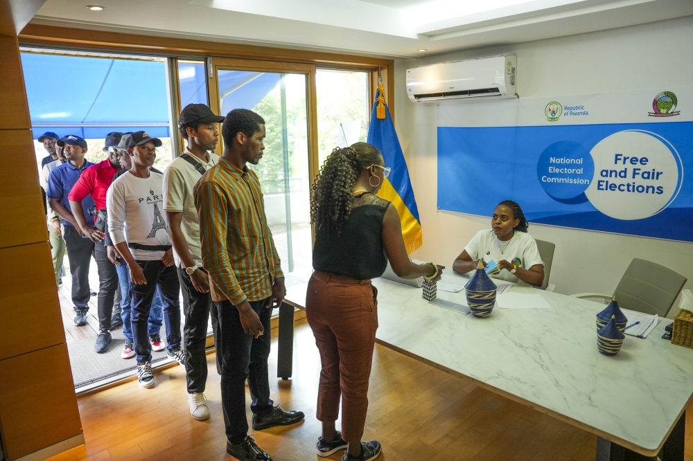 Rwandans arrive at the polling station to cast their votes during the presidential and parliamentary elections in South Korea on July 14. Courtesy