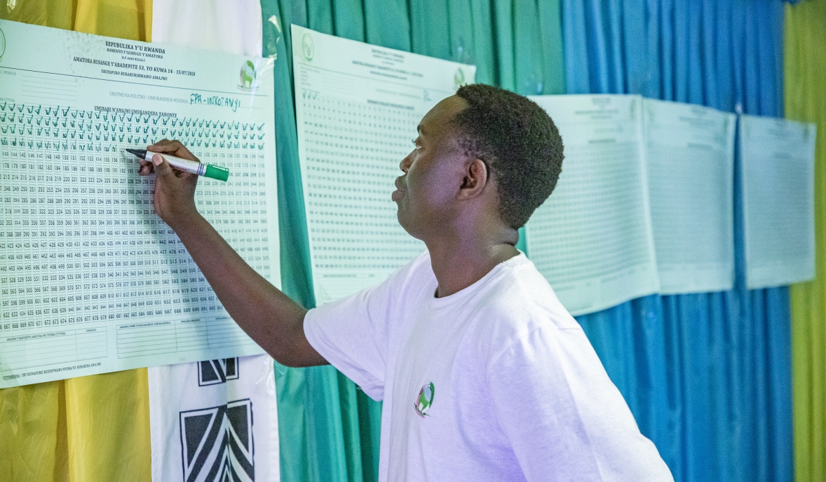 An election volunteer on duty during vote counting at  Remera Catholique polling station in Gasabo on July 15. Photos by Emmanuel Dushimimana.