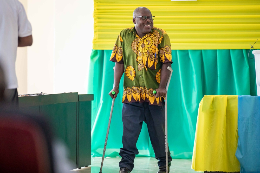 A voter among people with disabilities after casting his vote during the parliamentary elections in Kigali on Tuesday, July 16. Photos by Dan Gatsinzi