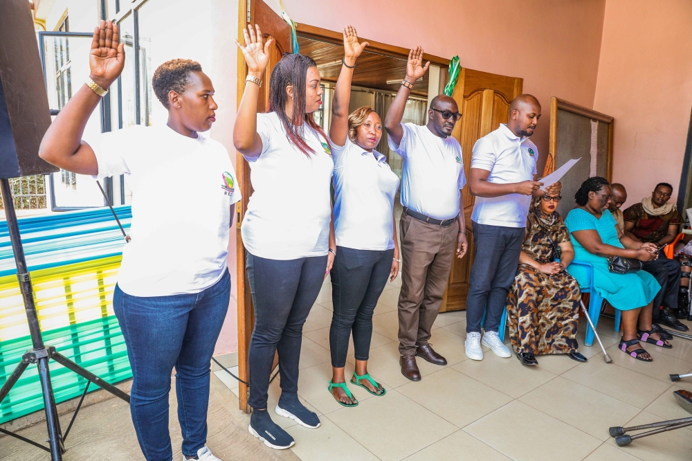 NEC staff take oath before starining the elections on Tuesday, July 16.