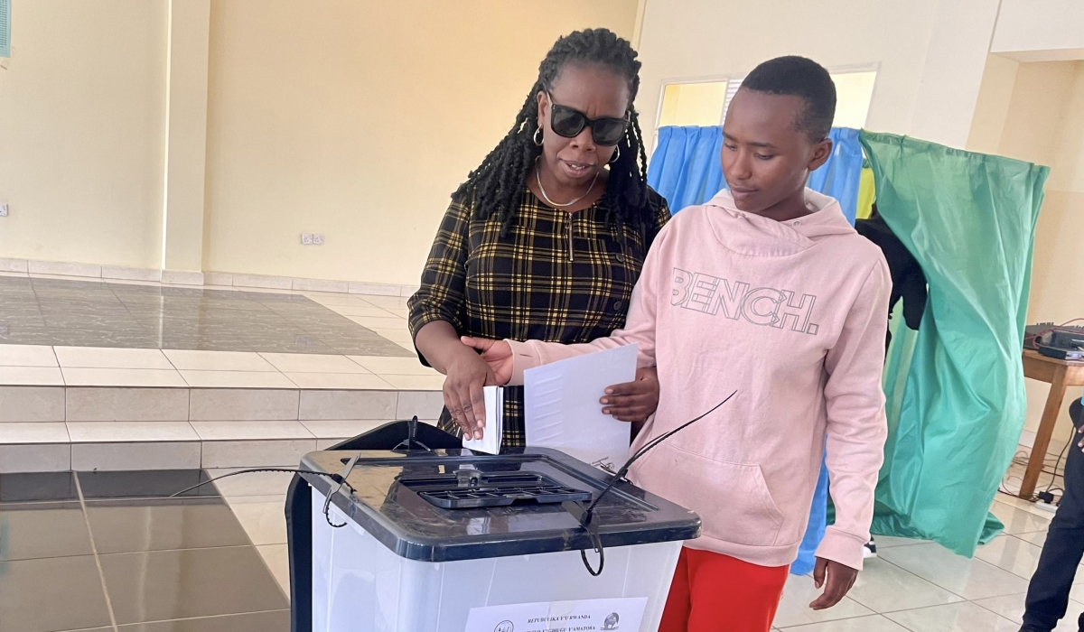 A person with visual impairment casts her vote, through the use of a braille ballot paper, to elect an MP representing persons with disabilities in Parliament, in Kimihurura, Gasabo, Kigali, on July 16, 2024. 