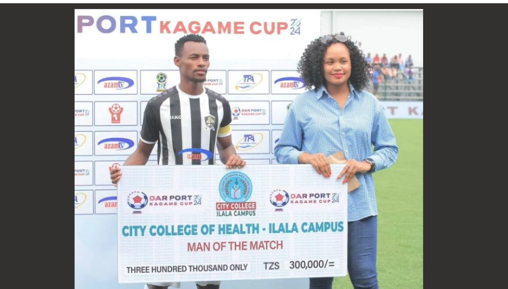 APR captain Claude Niyomugabo gets a cheque during CECAFA Kagame cup.